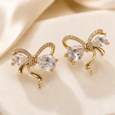 JIYARA Crystal Bow Stud Earrings – Gold Tone
